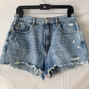 Garage Light Blue Distressed Jean Shorts with frayed hem.